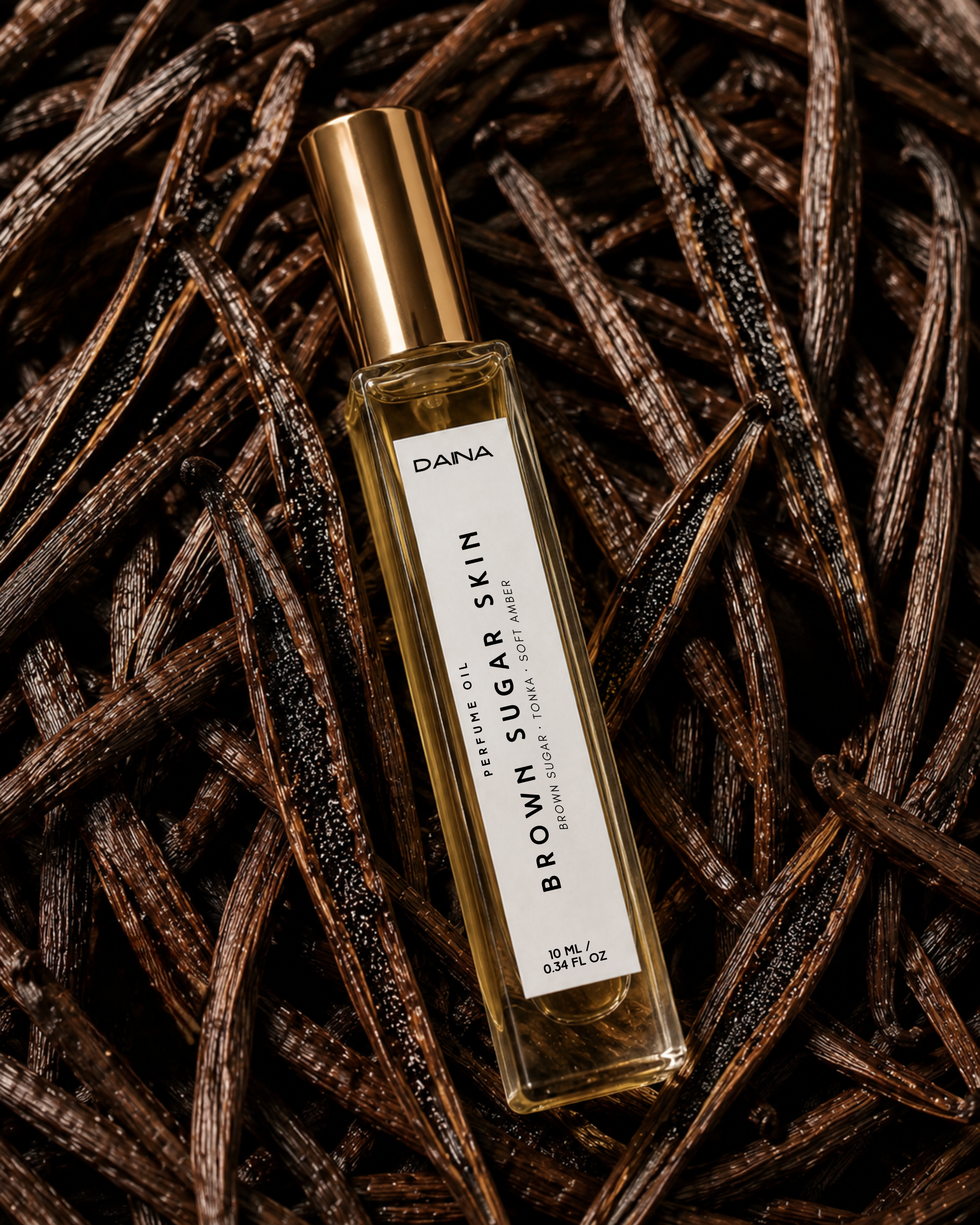 DAINA Brown Sugar Skin perfume oil on dark vanilla beans.