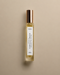 DAINA Vanilla Crush perfume oil bottle with gold cap on a beige background