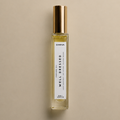 DAINA Well Dressed perfume oil, a fresh woody fragrance with crisp grapefruit, dry vetiver and polished woods in a 10 ml roller bottle.